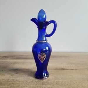 Vintage Avon cobalt blue bottle. vase/ decanter with lid.